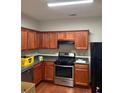 Well-equipped kitchen with modern stainless steel appliances and ample cabinet space at 162 Ledgewood Mill Way, Lawrenceville, GA 30045