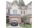 Charming townhome with a well-manicured lawn and inviting curb appeal at 3130 Haynes Park Dr, Lithonia, GA 30038