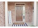 Inviting entryway with brick columns and landscaping at 3130 Haynes Park Dr, Lithonia, GA 30038
