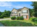 Beautiful exterior view of a home featuring an arched front door and driveway at 2175 Golden Valley Dr, Lawrenceville, GA 30043