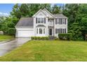 Charming two-story home with stone accents, well-manicured lawn, and a two-car garage at 570 White Stag Ct, Suwanee, GA 30024