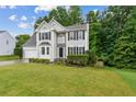 Charming two-story home with stone accents, well-manicured lawn, and a two-car garage at 570 White Stag Ct, Suwanee, GA 30024