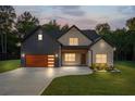Charming home featuring a mix of brick and board-and-batten siding, and a well-manicured lawn at 859 N Bay Overlook, Villa Rica, GA 30180