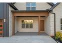 This home as a charming covered front porch with a stylish design at 859 N Bay Overlook, Villa Rica, GA 30180