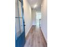 Inviting entryway featuring hardwood floors and a bright, airy ambiance with a view of the living space at 2407 Malster Ln, Lawrenceville, GA 30043