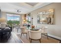 Stylish dining area with views from the balcony, seating four, and decorative mirror at 2626 Peachtree Nw Rd # 1108, Atlanta, GA 30305