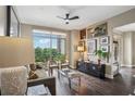 Bright living room featuring hardwood floors, balcony with views, and stylish decor at 2626 Peachtree Nw Rd # 1108, Atlanta, GA 30305