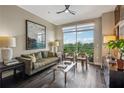 Cozy living room featuring a balcony with views and comfortable seating at 2626 Peachtree Nw Rd # 1108, Atlanta, GA 30305