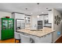 Modern kitchen features granite countertops, stainless steel appliances, and custom cabinets providing ample storage at 3317 Embry Hills Dr, Atlanta, GA 30341