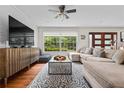Inviting living room with large windows, hardwood floors, and stylish decor, perfect for relaxation at 3317 Embry Hills Dr, Atlanta, GA 30341