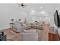 Bright living room boasts an open layout with hardwood floors, neutral colors, and recessed lighting at 597 Rich Davis Rd, Hiram, GA 30141