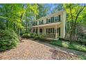 Traditional two-story home with a welcoming front porch and well-maintained landscaping at 6360 Lakeview Ter, Douglasville, GA 30135