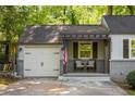Inviting covered front porch with comfortable seating and charming curb appeal at 1002 Forrest Blvd, Decatur, GA 30030