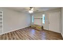 Bright living room featuring hardwood floors and a cozy fireplace at 7054 Chappell Cir, Atlanta, GA 30360