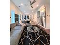 Stylish living room featuring a comfortable gray sectional, eye-catching rug, and modern black and white wall decor at 1463 Macklone Ne St, Atlanta, GA 30307