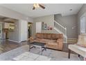View of living room leading to kitchen with staircase in the background at 3444 Washington Way, Atlanta, GA 30340