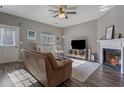 Inviting living room with fireplace, ceiling fan and wood-look floors at 3444 Washington Way, Atlanta, GA 30340