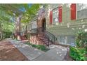 Attractive townhouses featuring well-maintained landscaping, brick stairs, and wrought iron railings at 2766 Wander Ln, Alpharetta, GA 30022