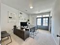 Modern office space with neutral carpet and double french doors at 548 Sawnee Village Blvd # D54, Cumming, GA 30040