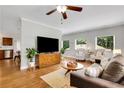 Bright living room features hardwood floors, neutral walls, and comfortable seating at 792 Mimosa Se Dr, Marietta, GA 30060