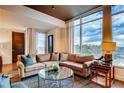 Cozy living room featuring comfortable sofa, lots of natural light and city views at 1820 Peachtree Nw St # 811, Atlanta, GA 30309
