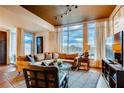Bright living room featuring comfortable seating, large windows, and a stylish rug at 1820 Peachtree Nw St # 811, Atlanta, GA 30309
