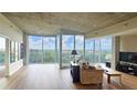 Bright living room with large windows and a balcony offering beautiful city views at 3300 Windy Ridge Se Pkwy # 1121, Atlanta, GA 30339