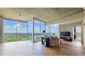 Spacious living room with hardwood floors and expansive windows overlooking a green landscape at 3300 Windy Ridge Se Pkwy # 1121, Atlanta, GA 30339