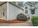 Charming curb appeal with stone accents, manicured bushes, and a well-kept walkway at 377 Tapley Rd, Villa Rica, GA 30180