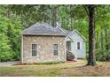 Well-kept single-Gathering home featuring stone facade and manicured landscaping at 377 Tapley Rd, Villa Rica, GA 30180