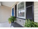 Inviting front porch with bench seating, plants, and a pop of color from the blue door at 1450 Walker Se St, Smyrna, GA 30080