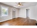 Bright living room featuring hardwood floors, modern ceiling fan, and fresh paint at 1450 Walker Se St, Smyrna, GA 30080