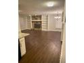 Open living room featuring a stone fireplace and custom built-in shelving at 2058 Pair Sw Rd, Marietta, GA 30008