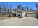 Beautiful home with a spacious driveway, attached garage, and well-maintained lawn, perfect for Gathering living and entertaining at 3891 Shelleydale Dr, Powder Springs, GA 30127