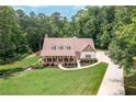 Beautiful two-story home with a covered porch and an expansive manicured lawn at 7131 Ridge Rd, Hiram, GA 30141
