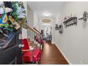 Welcoming foyer with hardwood floors, staircase with wood railing, and views of the living area at 3504 Castleberry Village Cir # 36, Cumming, GA 30040