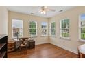 Bright office space featuring hardwood floors, three windows, and natural light at 2565 Grapevine Cir # 103, Cumming, GA 30041