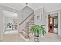 Elegant foyer with a staircase, chandelier, and views into other rooms at 335 S Satinwood Pl, Roswell, GA 30076
