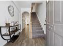 Inviting foyer with luxury vinyl plank flooring and stairs leading to the upper level at 771 Arbor Gate Ln, Lawrenceville, GA 30044