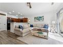 Comfortable living room area with a sliding glass door to a patio and a ceiling fan at 771 Arbor Gate Ln, Lawrenceville, GA 30044