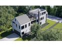 Expansive home with metal roof, multiple decks, private yard, and convenient driveway access at 339 Peachtree Ne Ave, Atlanta, GA 30305