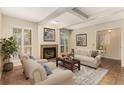 Cozy living room with fireplace, plush seating, and plantation shutters at 408 Coleraine Se, Smyrna, GA 30080