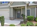 Inviting front porch with stone accents and well-maintained landscaping at 3112 Patriot Sw Sq, Marietta, GA 30064
