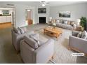 Bright living room with fireplace, neutral furniture, and open layout. (Virtually staged) at 688 Anderson Walk, Marietta, GA 30062
