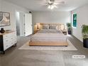 Bright main bedroom featuring neutral walls and soft carpet. (Virtually staged) at 688 Anderson Walk, Marietta, GA 30062