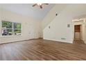 Bright living room featuring vaulted ceiling, wood flooring and large window at 179 Oakville Dr, Dallas, GA 30157