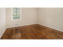 Cozy bedroom with hardwood floors and a bright window view at 1955 Vicki Se Ln, Atlanta, GA 30316