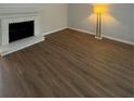 Bright living room with hardwood laminate flooring and a vintage fireplace at 2435 Northlake Ct, Atlanta, GA 30345