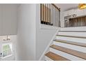 Stairway with wood treads, painted risers, and a traditional railing leading to the upper level at 2808 Maddison Towns Ave, Norcross, GA 30071