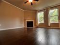 Spacious living room featuring hardwood floors, fireplace, and two large windows to allow natural light at 2778 Wild Laurel Ct, Norcross, GA 30071